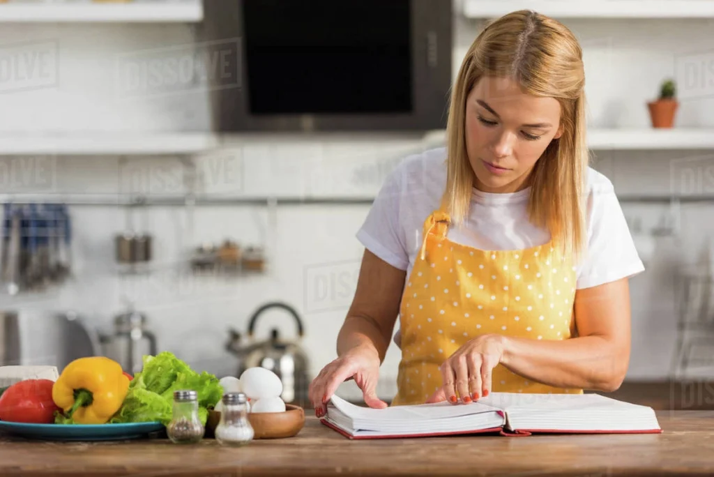 Cookbook reading in kitchen