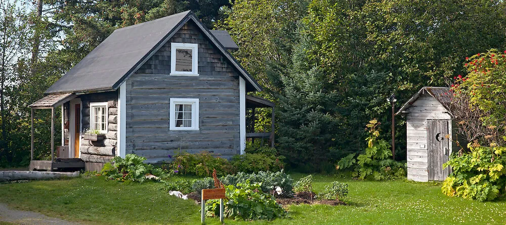 Vintage homesteader cabin in wide open field