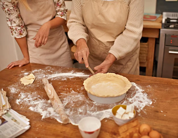 Woman making pie crust in cozy kitchen