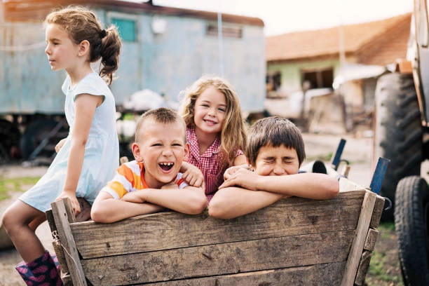Kids playing outside on a farm