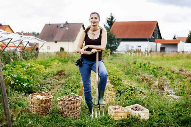 Rural farmer woman standing with pride