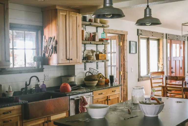 Old-fashioned homesteading kitchen with jars, tools, lard